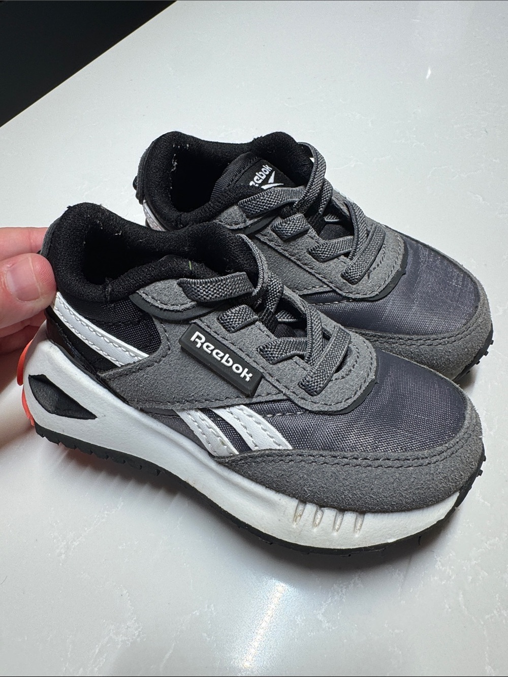 Reebok Kids Gray and Black Sneakers with Red Heel Accent